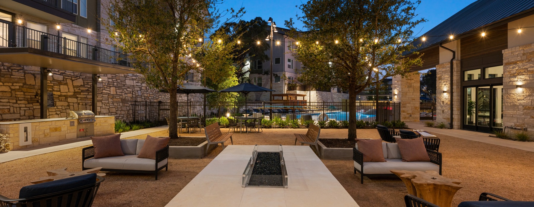 outdoor seating with firepit and pool